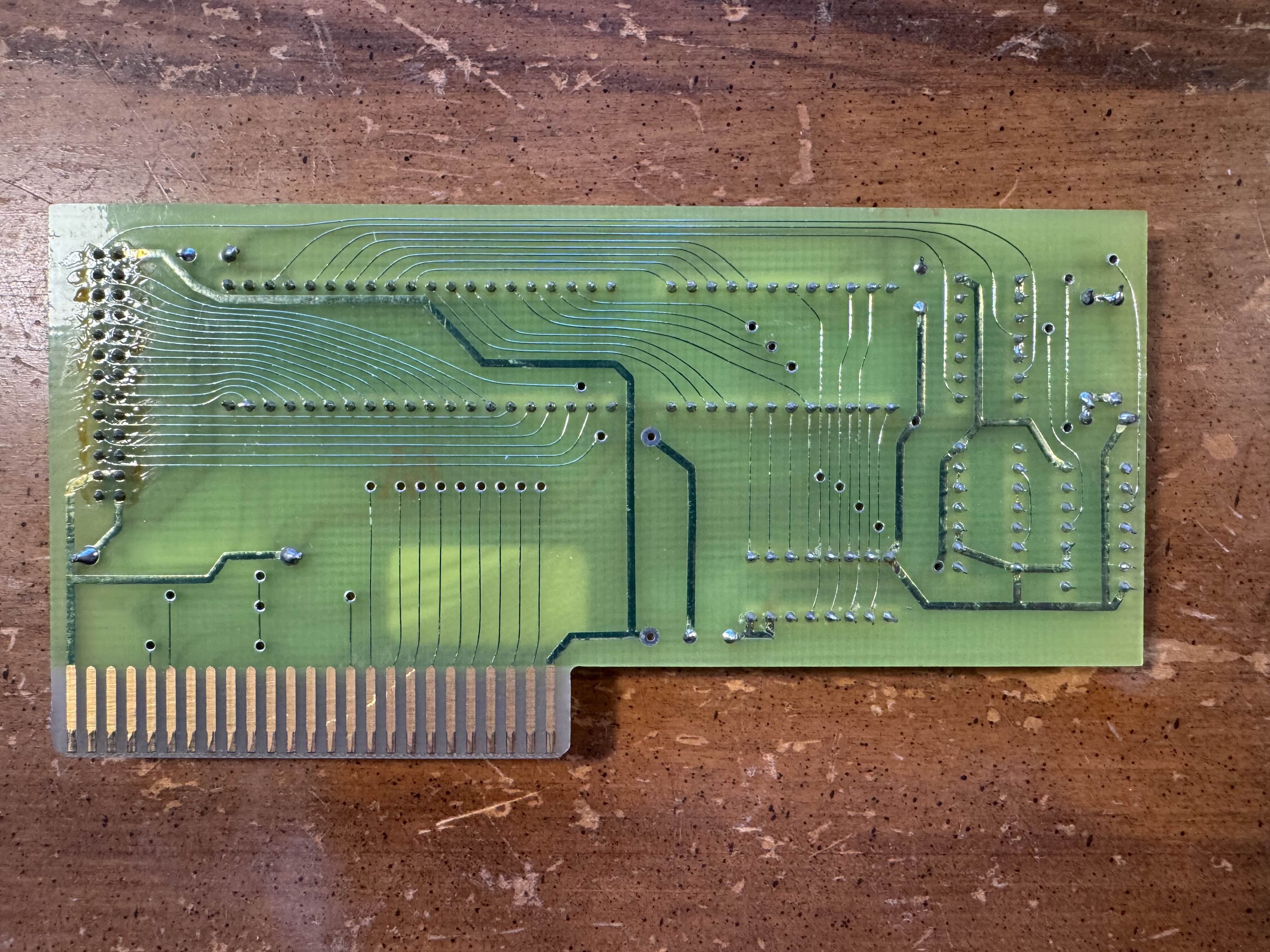 Back side of the card. There is extra solder flux over the external header pins.