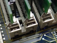 Metal-clips-on-memory-slots.jpg